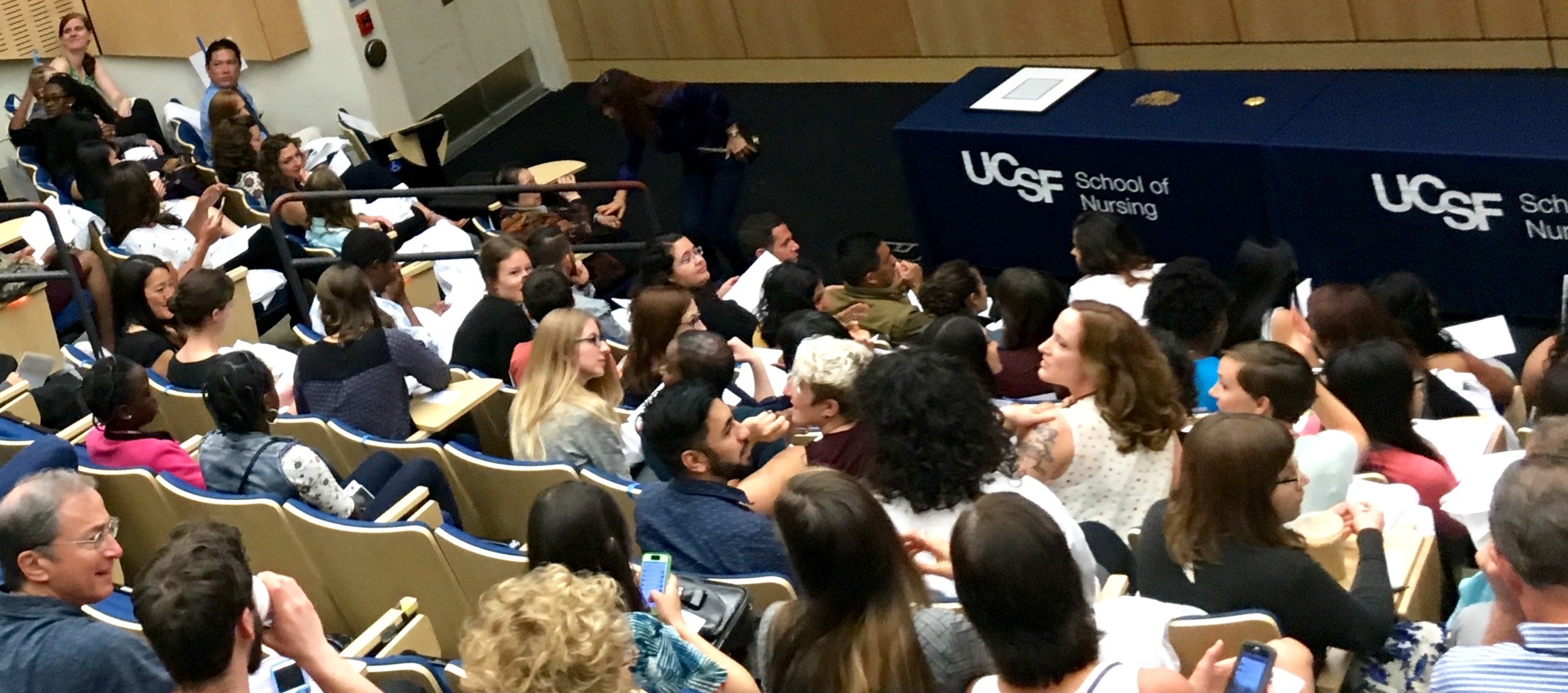 Audience gathers for start of MEPN White Coat Ceremony in UCSF's Cole Hall.