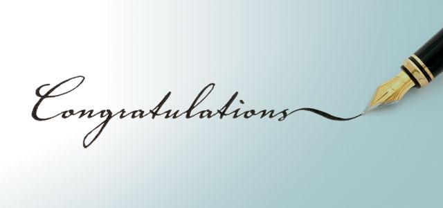A pen writing the word "Congratulations"