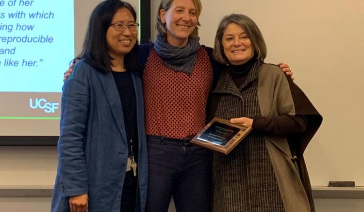 Ulrike Muench (center) is recognized for Excellence in Research Mentoring. Also pictured are Soo-Jeong Lee (left), chair of the Faculty Council, and Dean Catherine L. Gilliss.