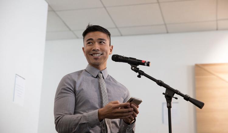 Faculty member Glenn Milo Santos reflects on the significance of the mural. (Photography by Elisabeth Fall) 