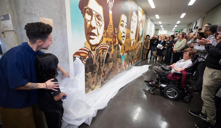 Faculty, students, staff, alumni and special guests celebrate the unveiling of the new mural at the UCSF School of Nursing. (Photography by Elisabeth Fall)