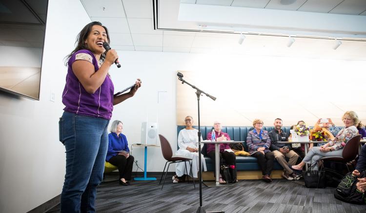 Karen Lopez-Acero, president of the Associated Students of the School of Nursing, talks about the importance of the mural. (Photography by Elisabeth Fall)