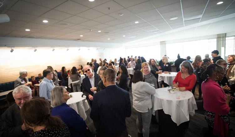 Faculty, students, staff, alumni and special guests celebrate the unveiling of the new mural at the UCSF School of Nursing. (Photography by Elisabeth Fall)