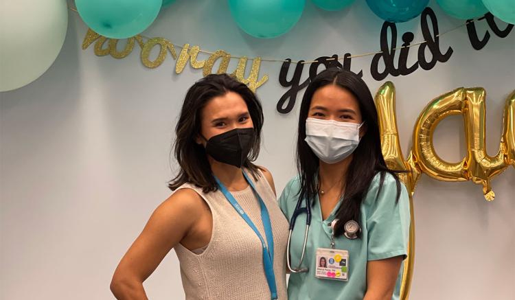 Mel Im-Giuffrida (left), who helped organize the event, is pictured with MEPN graduate Sherryl-Anne Perez at the Pin Pick-Up event.