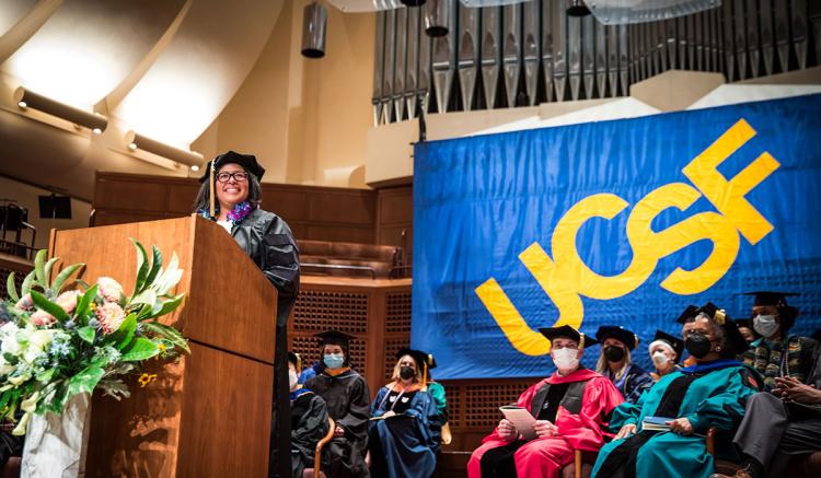 PhD graduate Angel Coaston delivers student remarks.