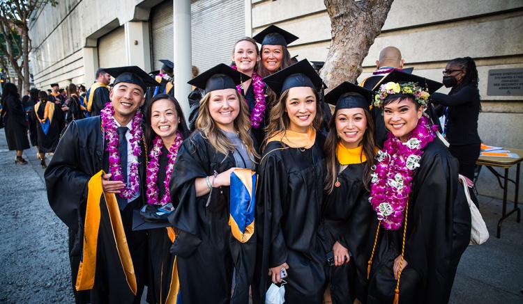 Members of the Class of 2022 gather at Davies Symphony Hall for Commencement.