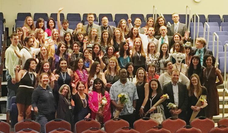 MEPN students and their faculty celebrate for the camera following the 2016 Pinning Ceremony.