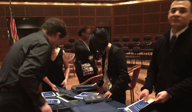 Student Affairs team helps prepare materials for commencement ceremony.