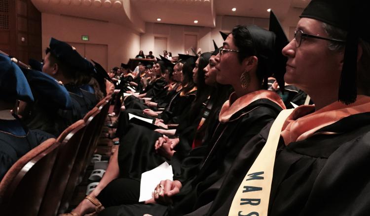 Crowd listens at the start of commencement ceremony.