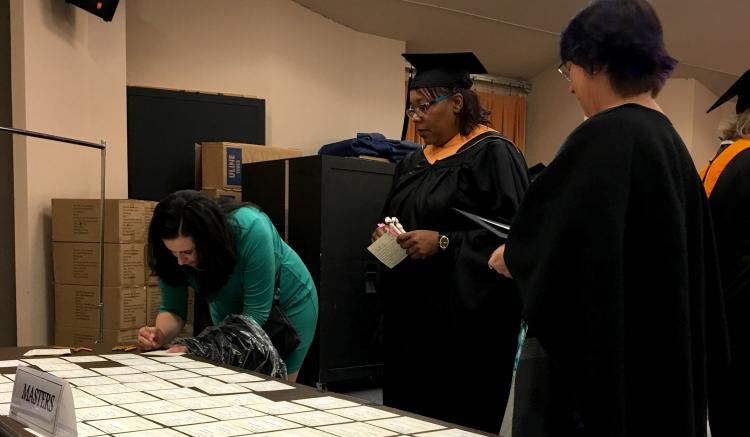 Student Affairs team prepares our graduates for the commencement ceremony.
