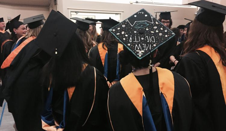 Graduates await the start of commencement ceremony.