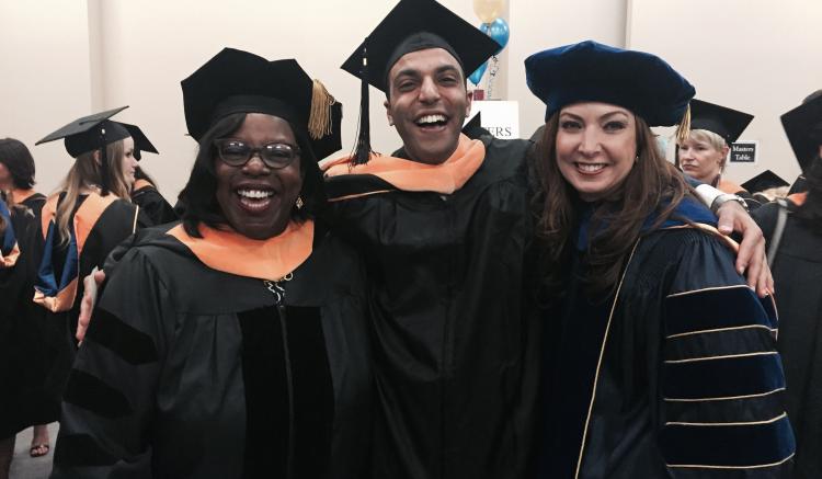 Keynote speaker and distinguished guest Sheila Antrum mingles with the graduates before the ceremony.