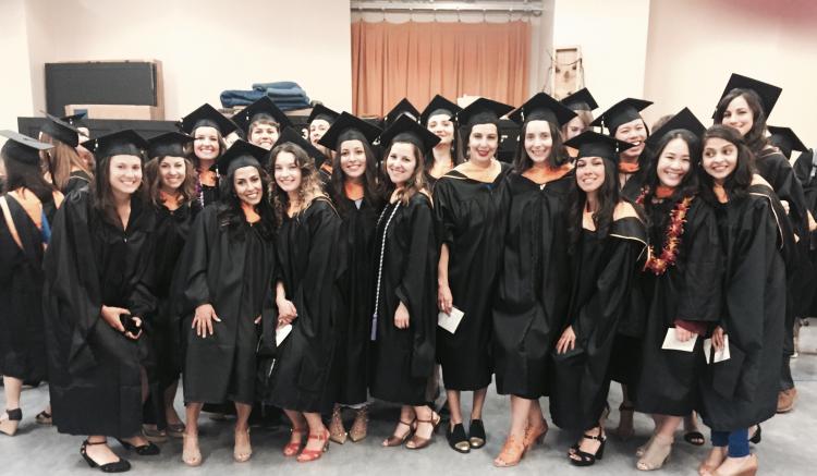 Group of graduates poses as they await the start of commencement.