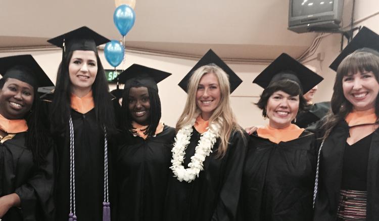 Group of graduates poses as they await the start of commencement.