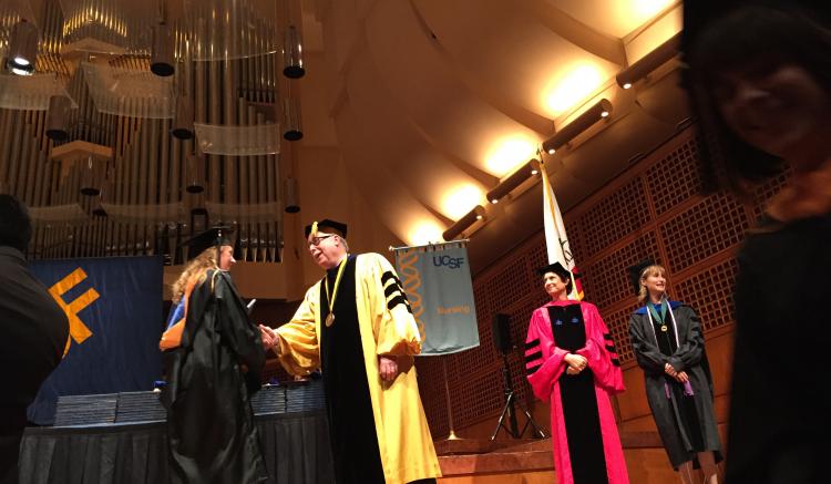 Nursing students receive their diplomas.
