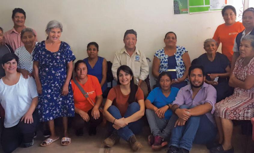 Carolina Noya (kneeling, third from left) joins patients, providers and community health workers at the first shared medical appointment in a rural community clinic  in Chiapas, Soledad. 