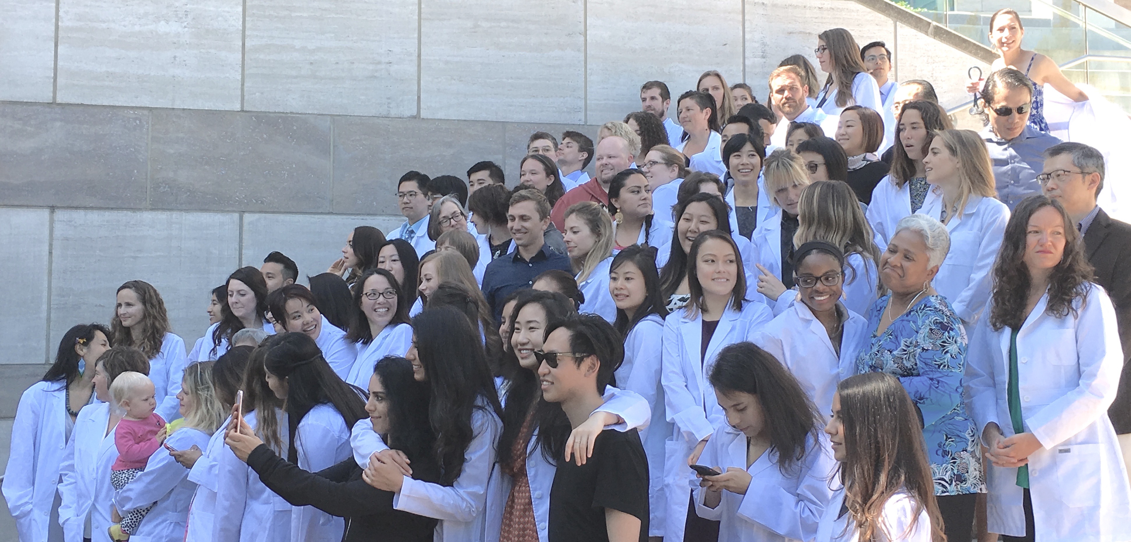Family and friends join the MEPN students in their White Coat group photo