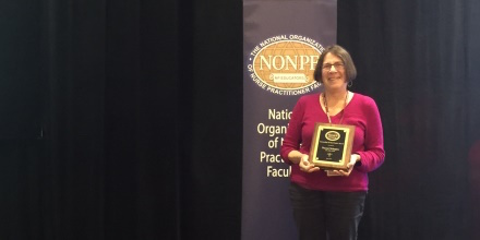 Naomi Schapiro, RN, PhD, PNP, stands with the Outstanding Faculty Practice Award at this year’s NONPF conference.