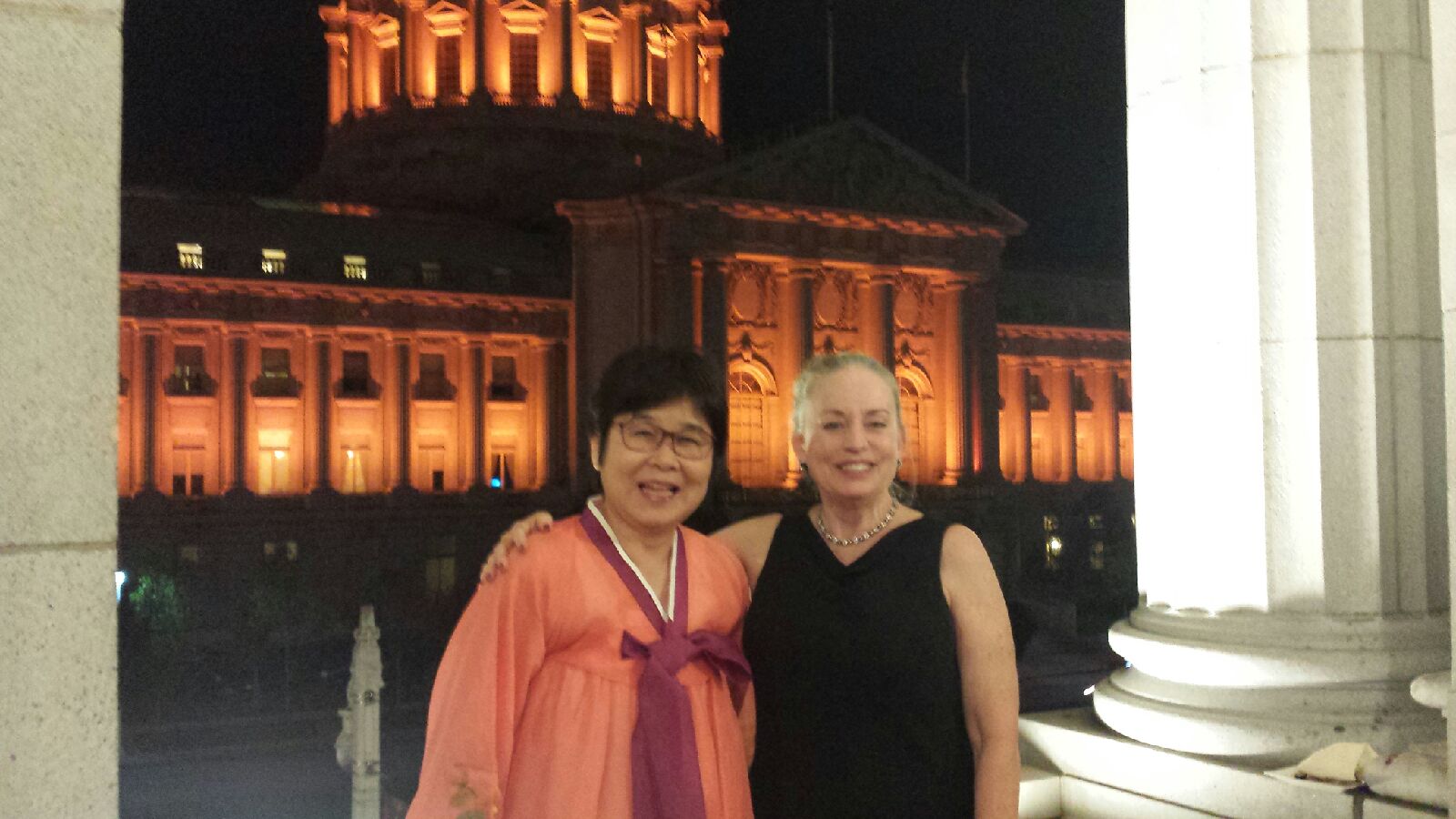 UCSF co-hosts stand in front of city hall at the celebration