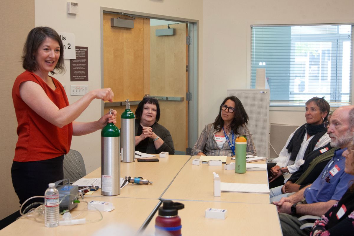 Kate Holbrook speaks to a group of workshop participants