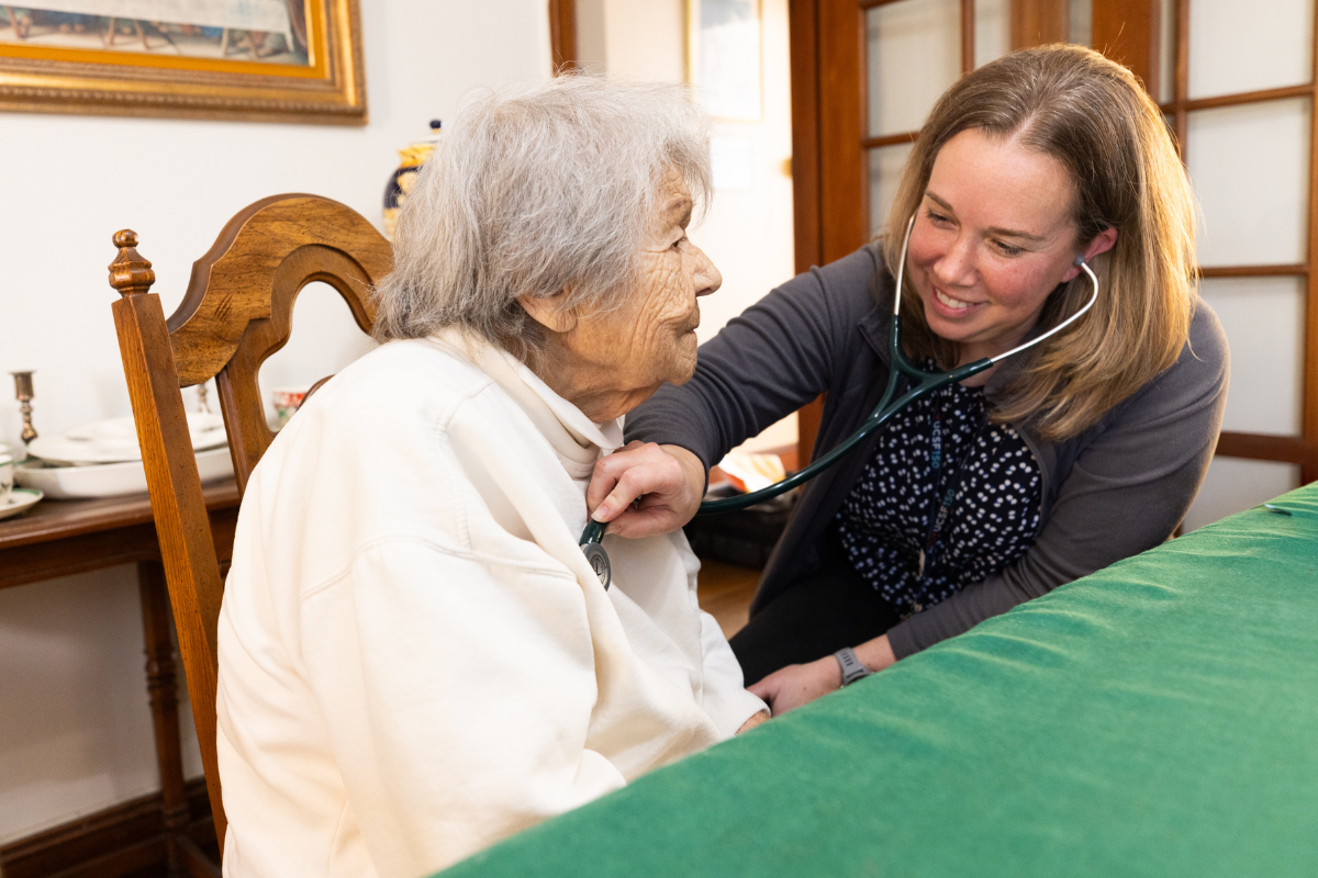 Courtney Gordon, DNP, NP, provides care to a patient in their home.