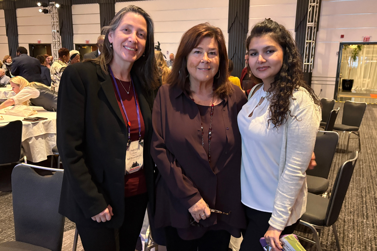 Carol Dawson-Rose stands with two colleagues at the 2025 ANAC Conference