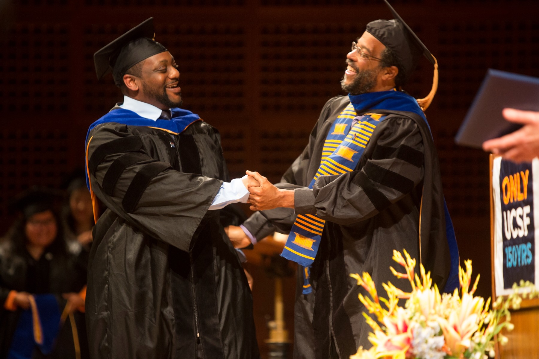 Rollins and Pinderhughes at the 2014 UCSF School of Nursing Commencement Ceremony
