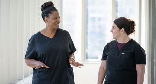 PMHNP student Janet Meda, left, speaks with her preceptor Ann Marie Coria, who is a PMHNP at UC Davis Health.