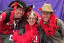 Three individuals smile at the SF AIDS Walk event