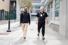Jim Gatewood walks with student