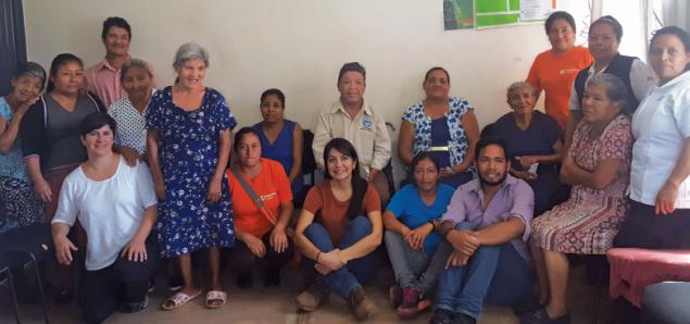Carolina Noya (kneeling, third from left) joins patients, providers and community health workers at the first shared medical appointment in a rural community clinic  in Chiapas, Soledad. 