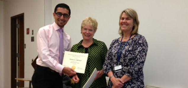 Sally Rankin (center) and Lisa Thompson present a global health minor certificate to Hamza Alduraidi. See PROFILES below to read his story and that of current student Rebecca Sedillo.