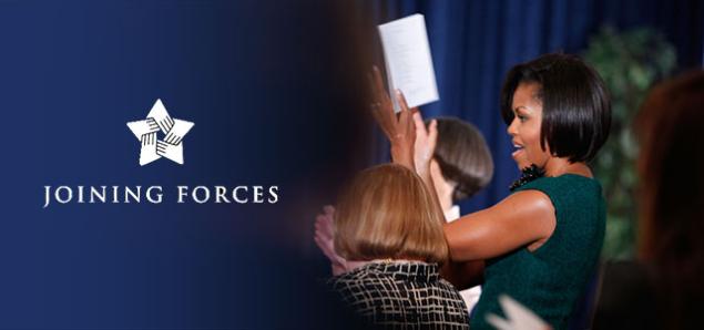 First Lady Michelle Obama cheers while attending a Joining Forces event.