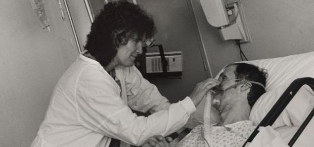 Diane Jones treats an early AIDS patient at San Francisco General in 1984 (photo by Gypsy Ray).