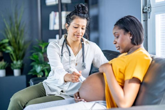 Nurse provides care to patient in their home