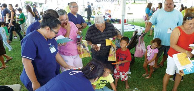 On Children and Youth Day in Honolulu, Chaminade nursing students conduct research and play nutritional games with children and families.