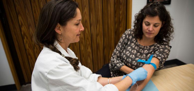 Genomics researcher Elena Flowers has her blood drawn as part of her hands-on approach to understanding the implications of genomics profiling. We will follow her efforts in a series of videos, articles and blog posts (photos by Elisabeth Fall; the video is a production of Bridge Media, Inc.).