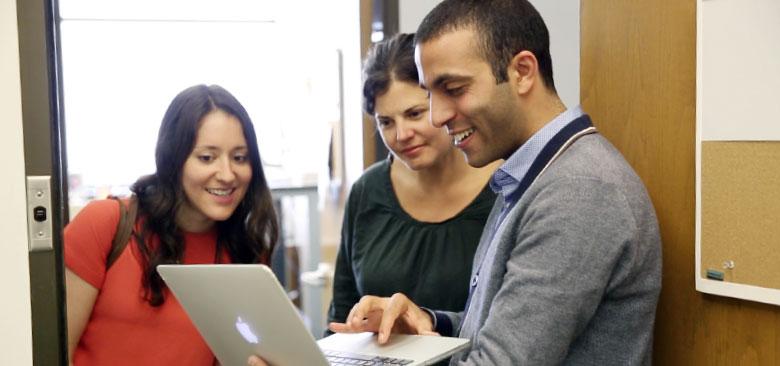 Elena Flowers (center) with students Katie Millar and Hamza Abid (photo and video by Elisabeth Fall)