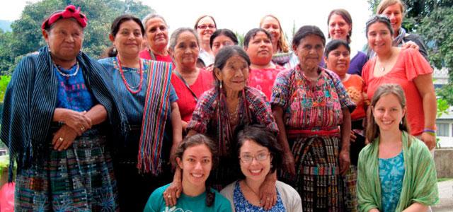 Jenna Shaw-Battista (bottom center, wearing glasses) with colleagues and local midwives in Guatemala