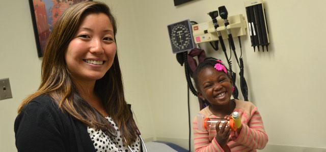 Kimberlee Honda (left), director of San Francisco General Hospital’s Pediatric Asthma Clinic, with a patient.