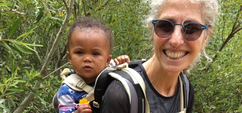 Erica Monasterio hiking in Glen Canyon Park with her grandbaby, Raimee