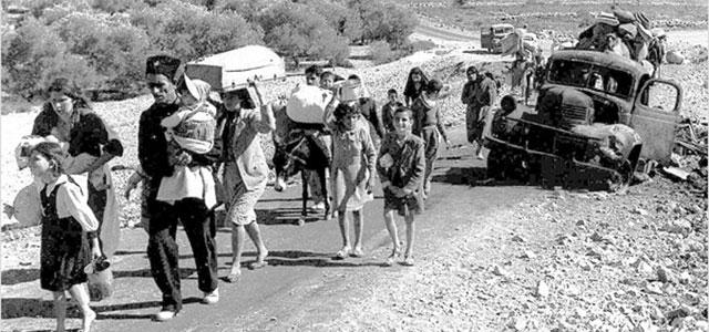 People travel by foot and car during the 1948 Palestinian exodus into Jordan