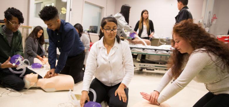 Students from Oakland Unified School District work on their resuscitation skills in the simulation lab (photos by Elisabeth Fall).