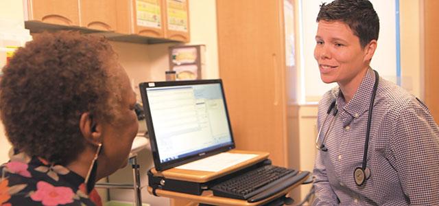  Rory Caygill-Walsh (right) with a patient at LifeLong Medical Care in Berkeley