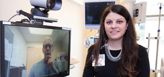 Tristin Penland readies the telehealth cart for a dermatology consult (photos by Elisabeth Fall).