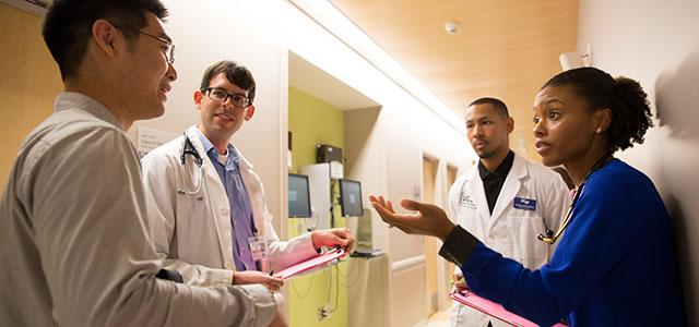 From left: UCSF dental student Brian P. Lee, medical student Noah Younger, pharmacy student Jason Kirkwood and nursing student Brianna Vixama participate in an interprofessional standardized patient exercise (photo by Elisabeth Fall).