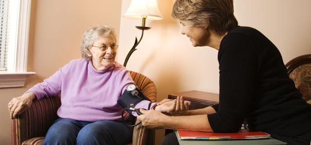 Nurse holds the hand of a patient