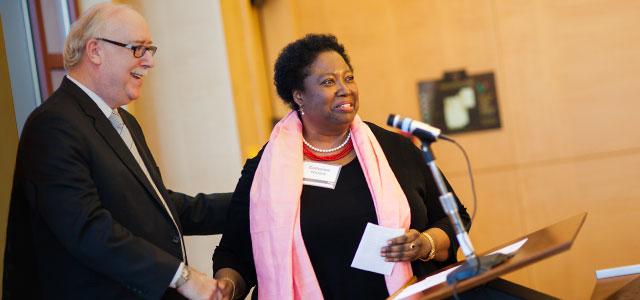 Dean David Vlahov introduces Catherine Waters at the Sally Bates Endowed Chair in Health Disparities induction ceremony (photos by Elena Graham).