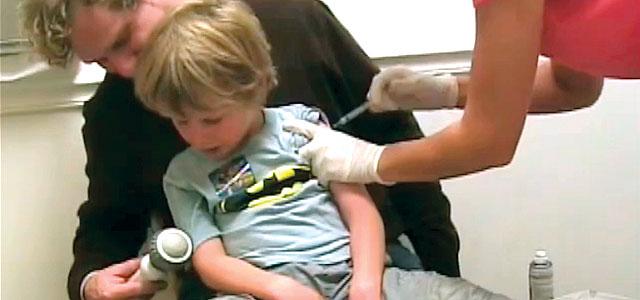 Child receives an immunization. 