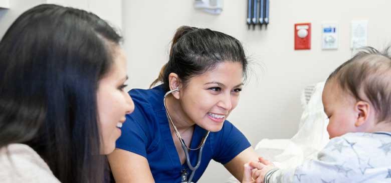 Nurse speaks with pediatric patient and their parent